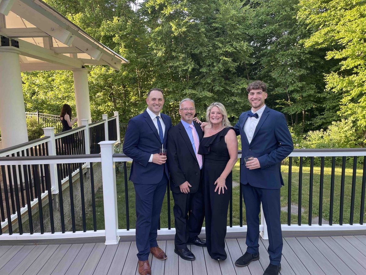 Chris with family at a summer celebration