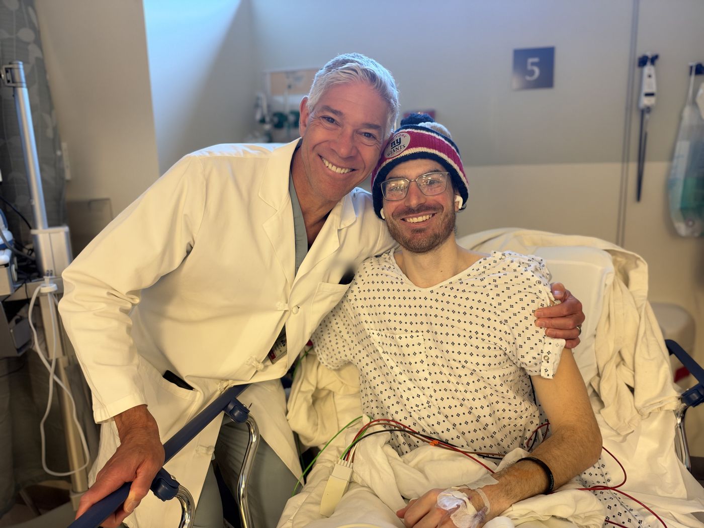 Chris smiling with one of his doctors